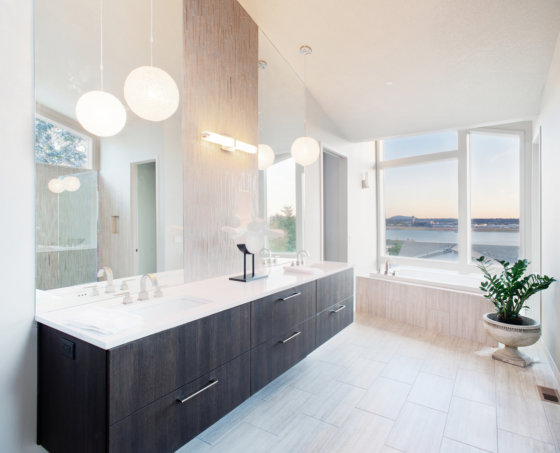 Modern bathroom with a waterfront view.